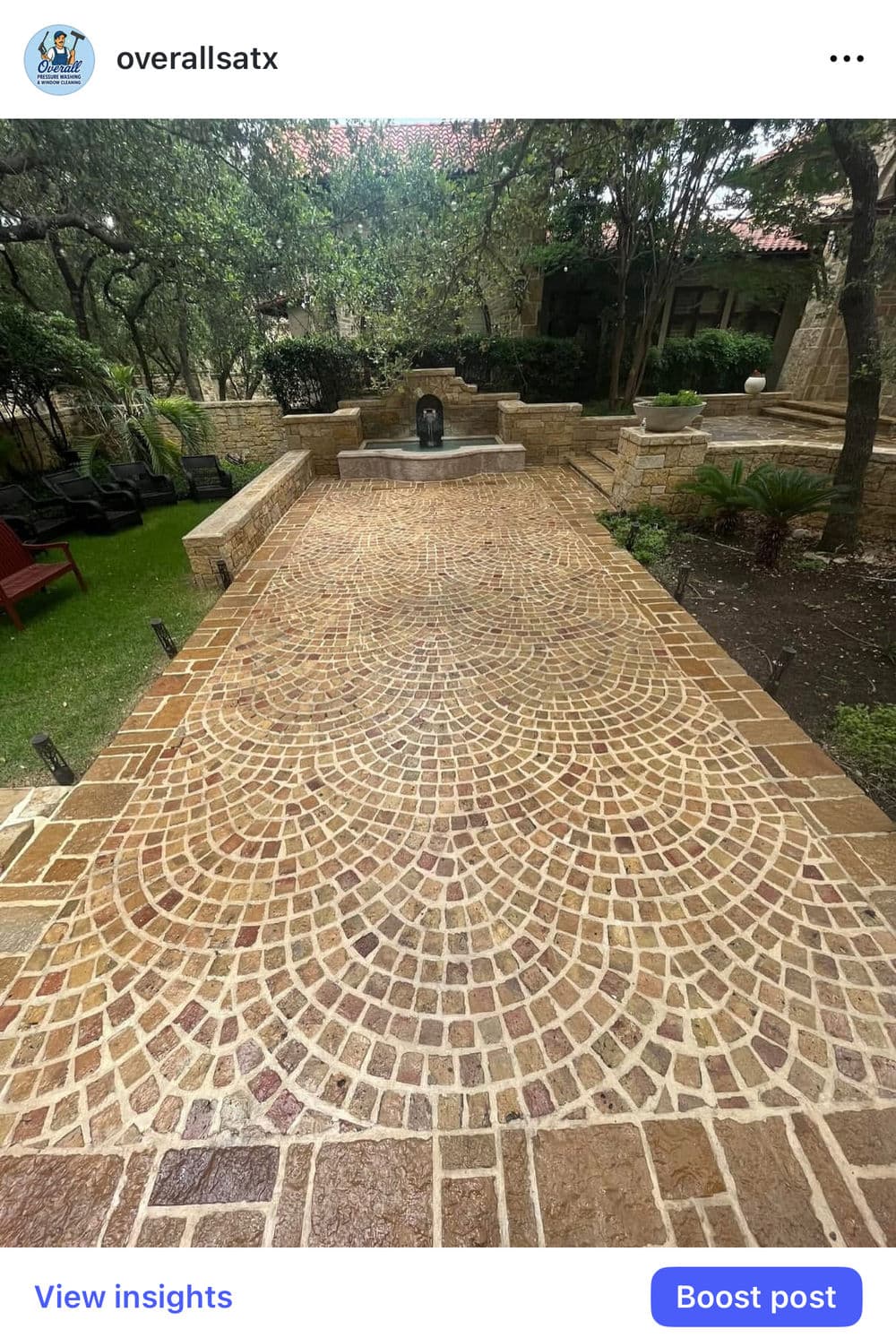 Beautifully patterned cobblestone pathway in a serene garden setting with greenery.