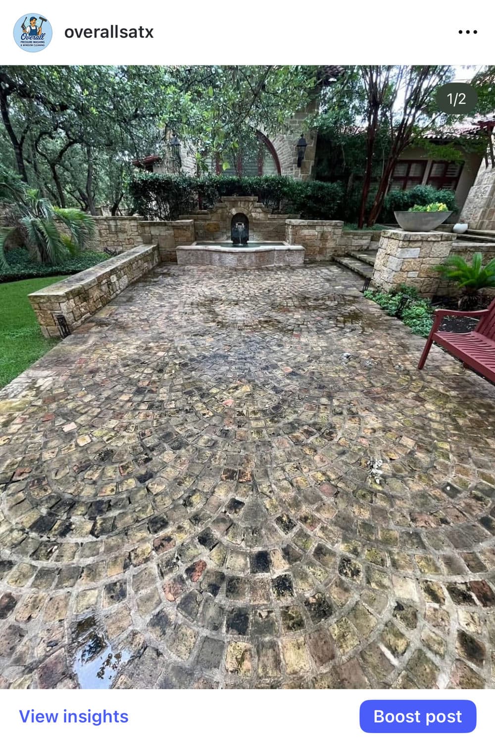 Paved stone courtyard with fountain surrounded by greenery and seating area.